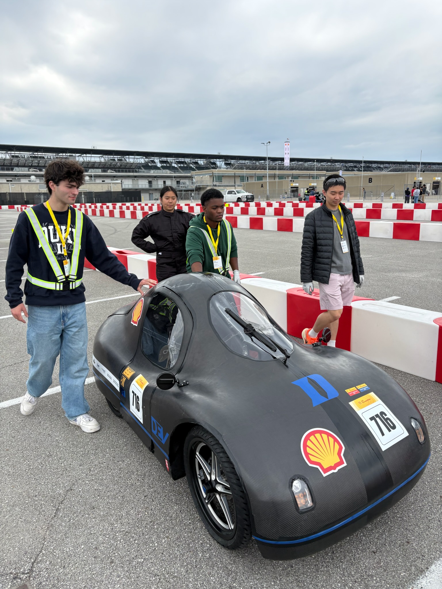 The team pushing car 716 through the Indianapolis paddock